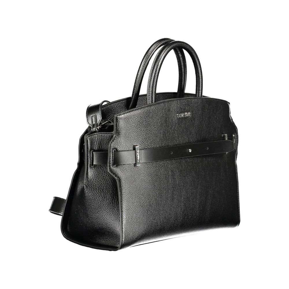 Crossbody Handbag by Calvin Klein for women in polyester & polyurethane black features a ornamental silhouette, showcasing a secure zipper, ample , and ornamental crossbody-strap, shoulder-strap, handle, adjustable-strap & detachable-strap for a sophisticated look.