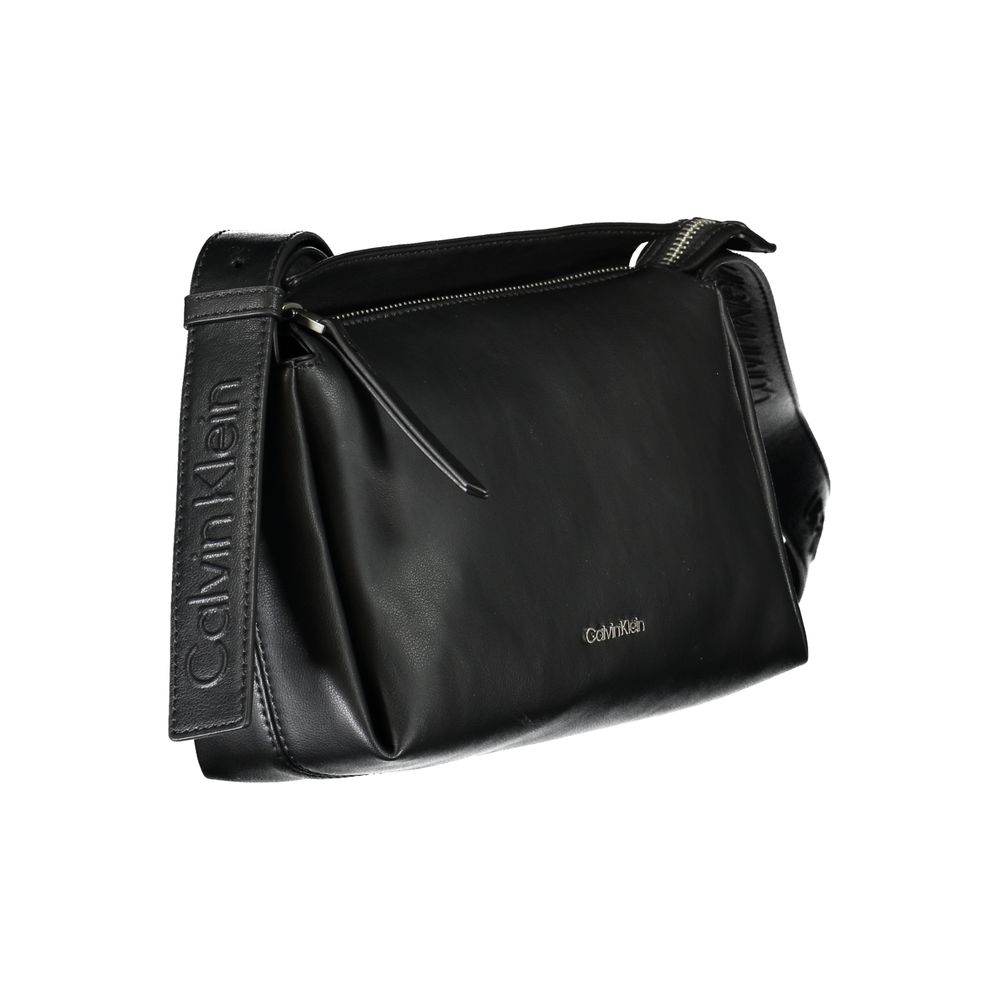 Shoulder Convertible Handbag by Calvin Klein for women in polyester faux leather black presents a exquisite silhouette, showcasing a secure zipper and organized cardholder with versatile shoulder-strap & adjustable-strap.