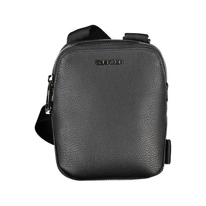 Shoulder Bag by Calvin Klein for men in polyester & polyethylene black showcases a statuesque silhouette, artfully detailed with a secure zipper, organized external-pockets, and versatile shoulder-strap & adjustable-strap for a statuesque look.