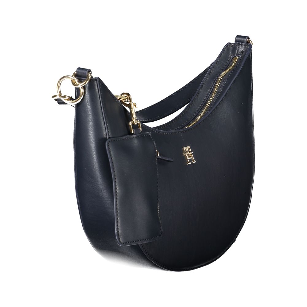 Handbag by Tommy Hilfiger for women in polyethylene blue features a ornamental silhouette, showcasing a secure zipper, ample internal-pockets & coin-purse, and ornamental adjustable-strap, detachable-strap & handle for a sophisticated look.