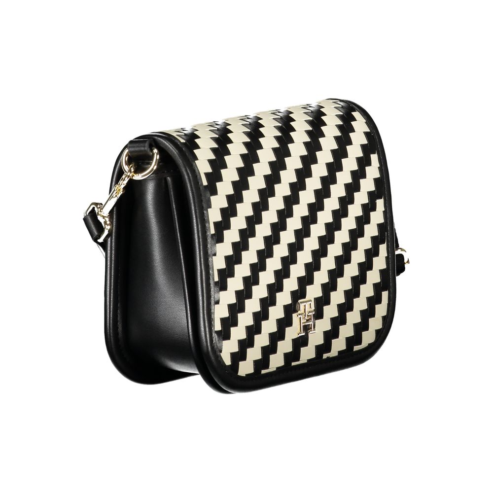 Compact Crossbody Convertible Handbag by Tommy Hilfiger for women in polyurethane faux leather black, gold, white, patterned & striped presents a enviable design with a secure snap, ample internal-pockets & coin-purse, and versatile crossbody-strap, adjustable-strap & detachable-strap for a sophisticated look.