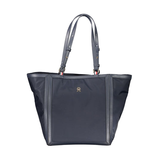 Shopper Tote Convertible Handbag by Tommy Hilfiger for women in polyester blue features an exquisite silhouette, showcasing a secure zipper, ample internal-pockets, and versatile adjustable-strap & handle for exquisite style.