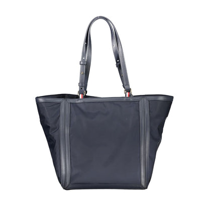Shopper Tote Convertible Handbag by Tommy Hilfiger for women in polyester blue presents a enviable design with a secure zipper, ample internal-pockets, and versatile adjustable-strap & handle for a sophisticated look.