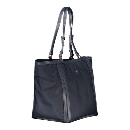 Shopper Tote Convertible Handbag by Tommy Hilfiger for women in polyester blue features a exquisite silhouette with a secure zipper, ample internal-pockets, and versatile adjustable-strap & handle for a exquisite look.