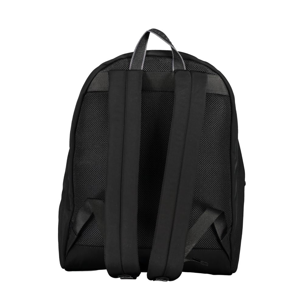 Travel Backpack by Tommy Hilfiger for men in polyester black features a architectural City Polyester Travel Backpack design with a secure zipper, ample external-pockets, internal-pockets & laptop-compartment, and versatile handle, backpack-strap & adjustable-strap for a architectural finish.