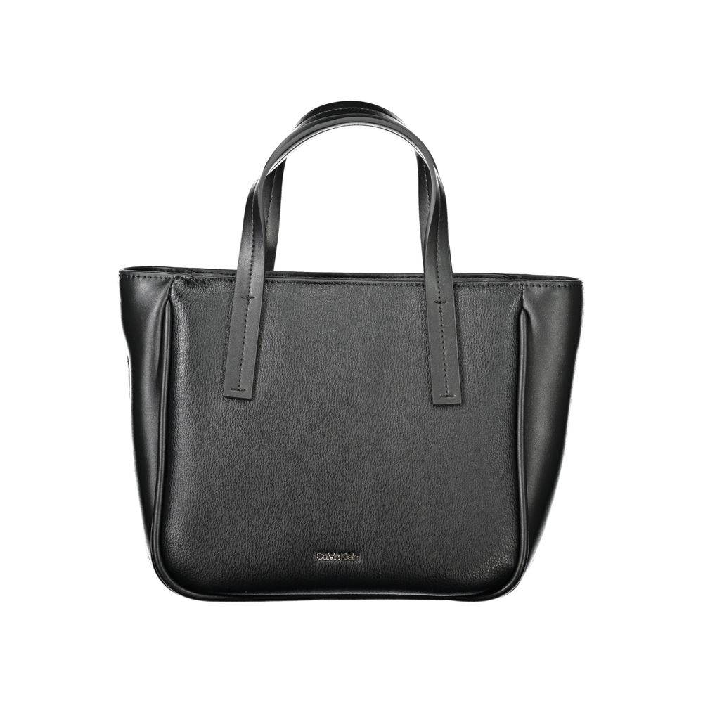 Shopper Handbag by Calvin Klein for women in polyester & polyethylene faux grained leather black features a exquisite silhouette, showcasing a secure zipper and exquisite with versatile shoulder-strap, adjustable-strap & handle for a exquisite finish.