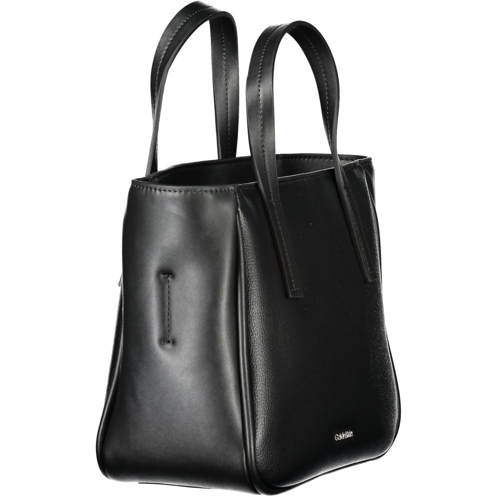 Shopper Handbag by Calvin Klein for women in polyester & polyethylene faux grained leather black features a refined silhouette, showcasing a secure zipper, organized , and versatile shoulder-strap, adjustable-strap & handle for a refined finish.