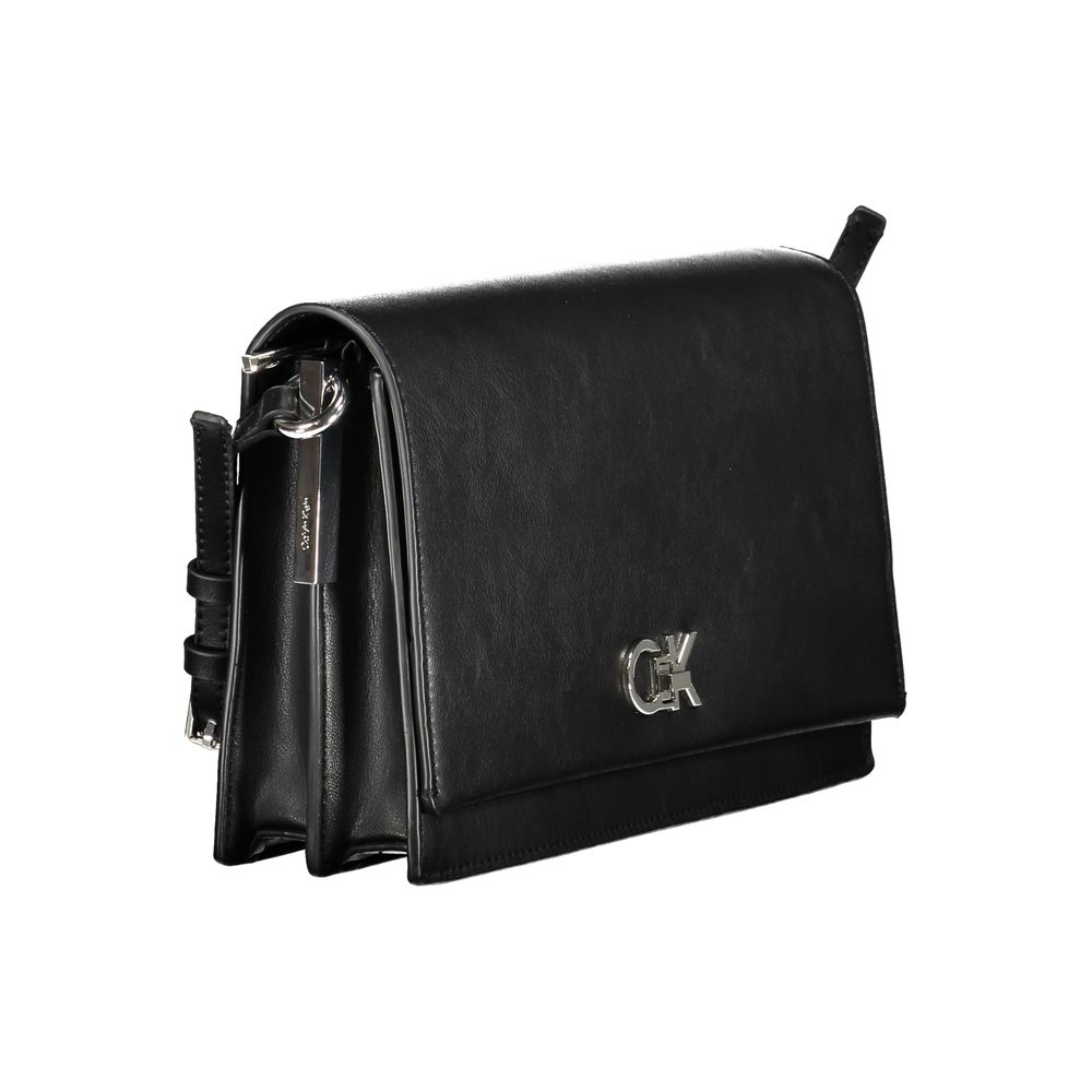 Handbag by Calvin Klein for women in polyester polyethylene faux leather black features a signature silhouette, showcasing a secure zipper and signature built-in-compartments & cardholder with versatile adjustable-strap & handle for a sophisticated look.