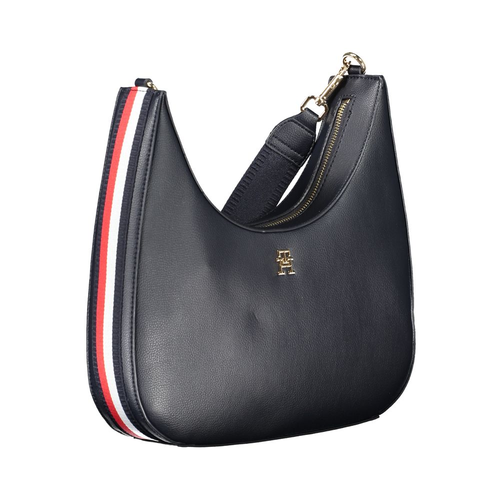 Shoulder Handbag by Tommy Hilfiger for women in polyester & polyurethane blue features a refined silhouette, showcasing a secure zipper, organized internal-pockets, and versatile shoulder-strap, adjustable-strap & handle for a refined finish.