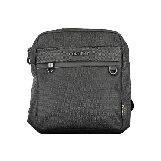 Shoulder Bag by Calvin Klein for men in polyester & polyethylene black features a effortless chic silhouette with a secure zipper, ample external-pockets & internal-pockets, and versatile shoulder-strap, adjustable-strap & handle for a effortless chic finish.
