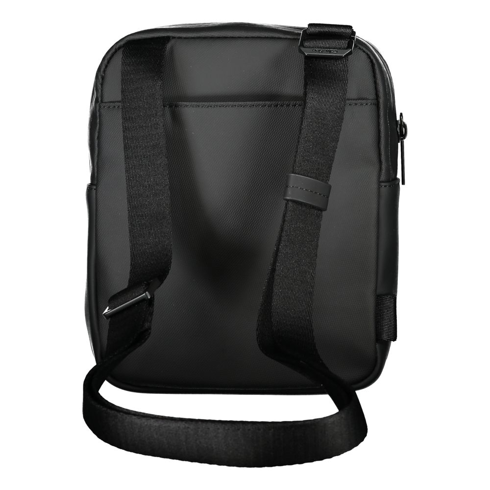 Shoulder Bag by Calvin Klein for men in polyester & polyethylene black & signature presents a statuesque silhouette, showcasing a secure zipper and statuesque external-pockets & internal-pockets with versatile shoulder-strap & adjustable-strap for a sophisticated look.