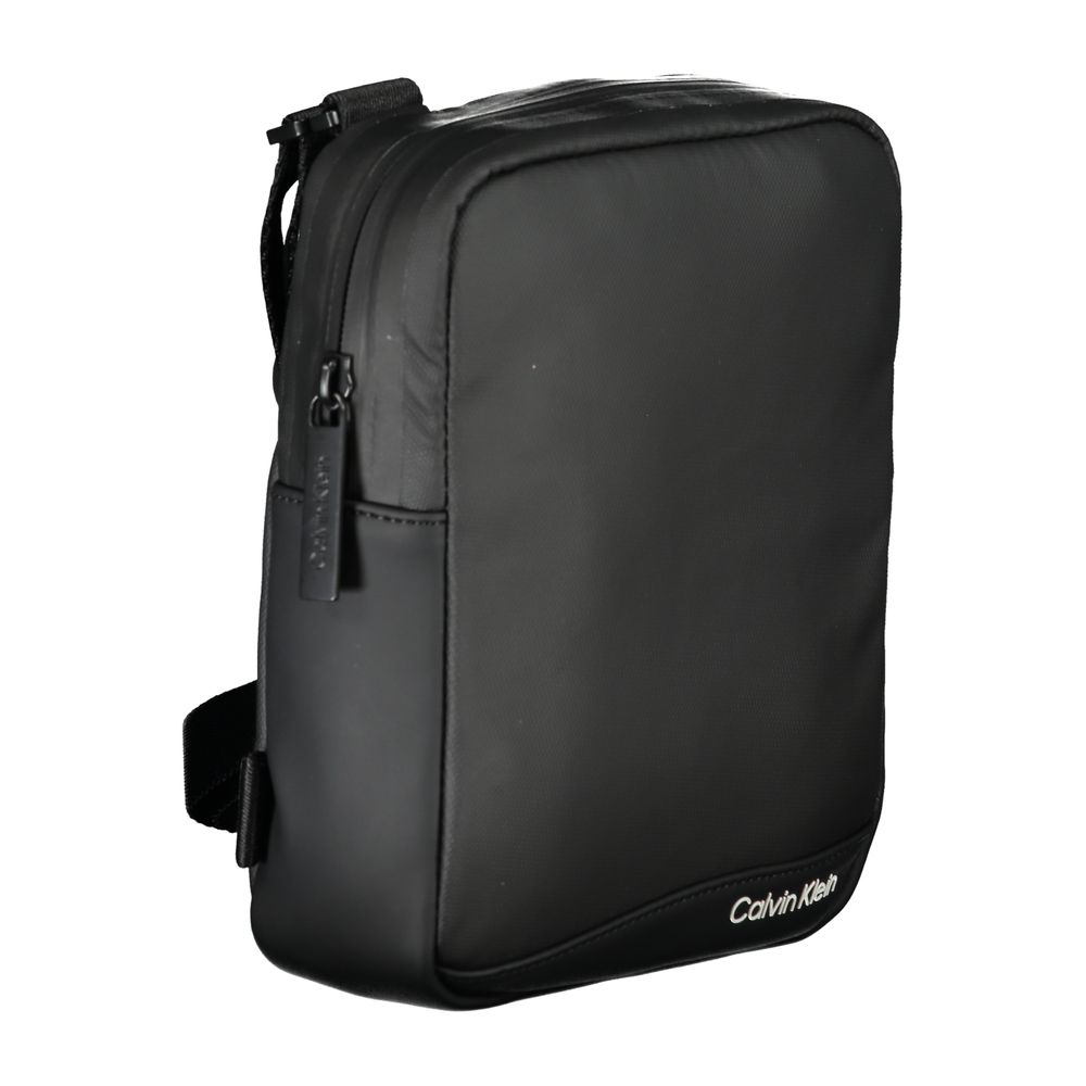 Shoulder Bag by Calvin Klein for men in polyester & polyethylene black & signature features a statuesque silhouette, showcasing a secure zipper and statuesque external-pockets & internal-pockets with versatile shoulder-strap & adjustable-strap for a statuesque finish.