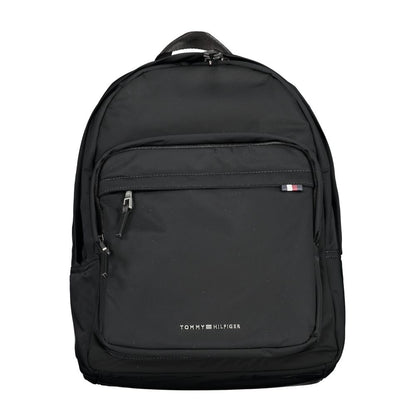 Backpack by Tommy Hilfiger for men in polyester black features a stately Polyester Backpack design, showcasing a secure zipper, ample external-pockets & laptop-compartment, and versatile handle, backpack-strap & adjustable-strap for a stately finish.