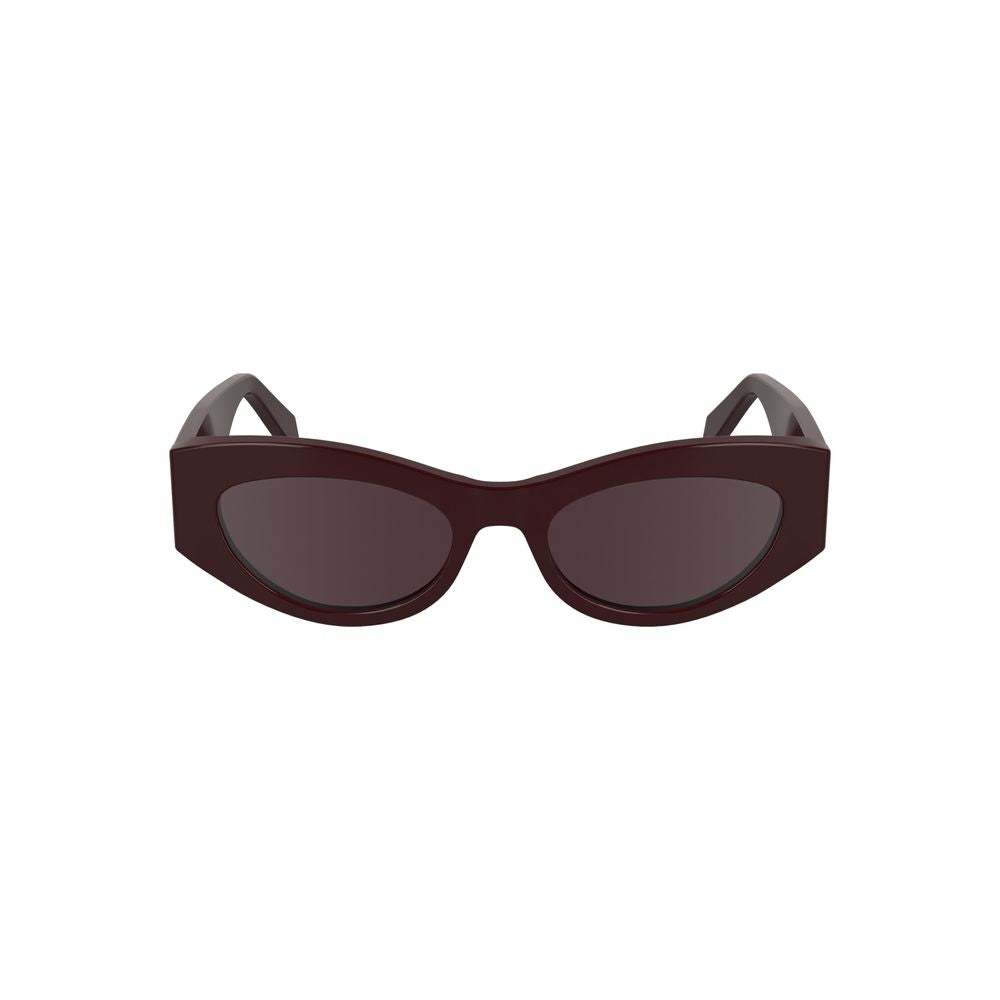 Sunglasses by Calvin Klein for women in and brown & red presents a sumptuous silhouette, featuring red coloured frame and cat-eye frame design with for a sumptuous look.