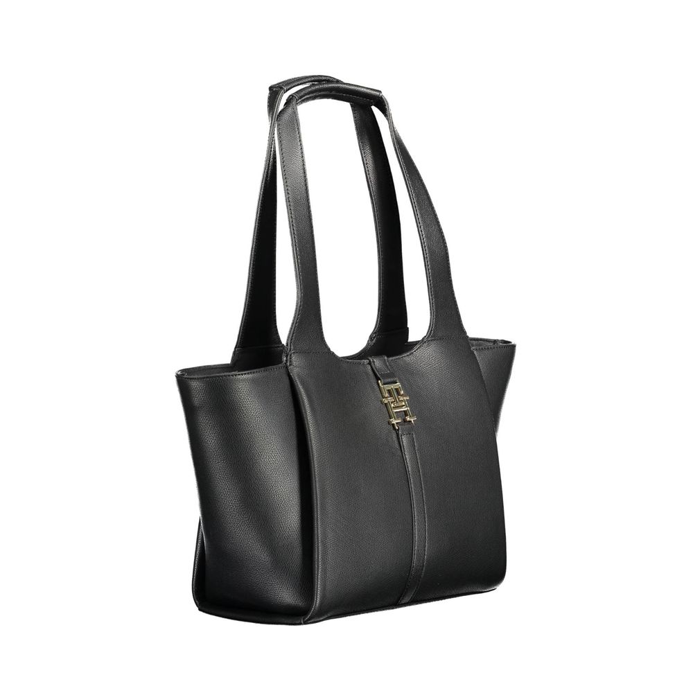 Shoulder Shopper Tote Convertible Handbag by Tommy Hilfiger for women in polyethylene faux leather black & gold features a polished silhouette with a secure snap, ample internal-pockets, and polished shoulder-strap & handle for a sophisticated look.