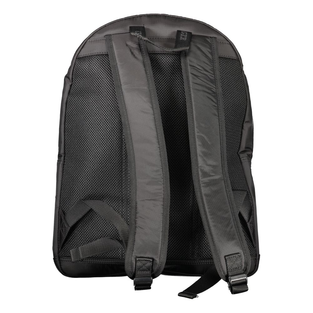 Backpack by Tommy Hilfiger for men in nylon black & signature features a stately Nylon Backpack design, showcasing a secure zipper, ample external-pockets, internal-pockets & laptop-compartment, and versatile handle, backpack-strap & adjustable-strap for a stately finish.