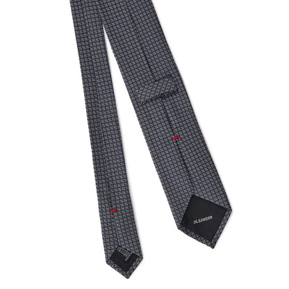 Necktie by Jil Sander for men in silk gray, navy & print features an effortlessly chic silhouette, showcasing a sophisticated effortlessly chic finish from the signature Silk Necktie collection.