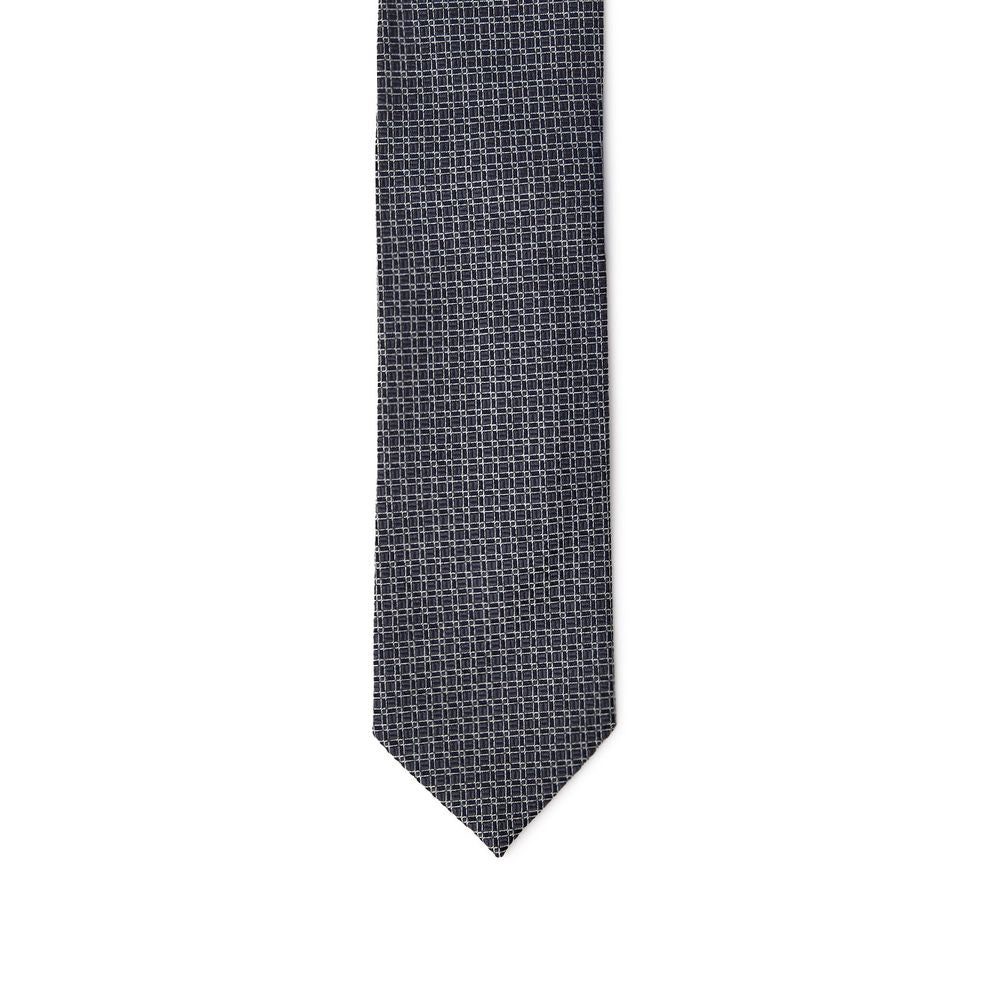 Necktie by Jil Sander for men in silk gray, navy & print features an stately silhouette that beautifully highlights the sophisticated style of the Silk Necktie.