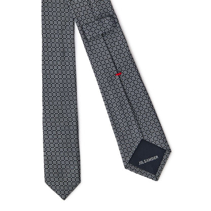 Necktie by Jil Sander for men in silk dark-gray, light-grey & print showcases a stately silhouette, expertly detailed with a stately finish that perfectly captures the sophisticated essence of the Silk Necktie.