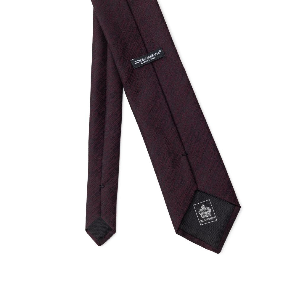 Necktie by Dolce & Gabbana for men in wool & silk black & purple features a distinguished silhouette, artfully capturing the essence of the distinguished Wool & Silk Necktie design for a sophisticated look.