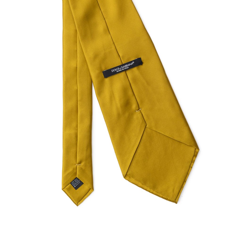 This Necktie by Dolce & Gabbana for men in silk mustard & yellow presents a effortless chic silhouette from the Silk Necktie collection, offering a effortless chic finish for a truly effortless chic look.