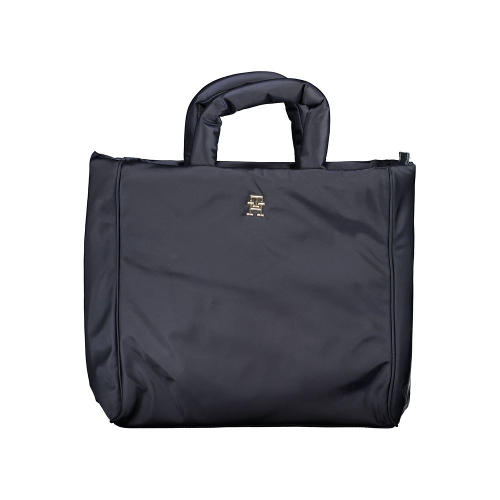 This Handbag by Tommy Hilfiger for women in polyester & polyethylene and blue presents a sculptural silhouette featuring a secure zipper, ample , and versatile shoulder-strap, adjustable-strap & handle for a sculptural finish.