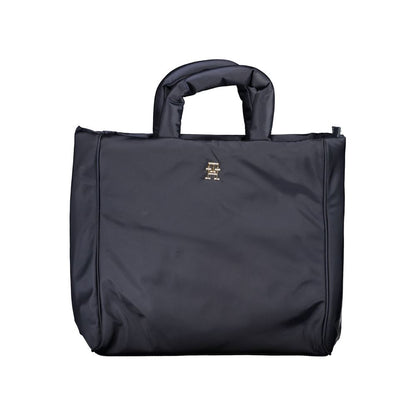 This Handbag by Tommy Hilfiger for women in polyester & polyethylene and blue presents a sculptural silhouette featuring a secure zipper, ample , and versatile shoulder-strap, adjustable-strap & handle for a sculptural finish.