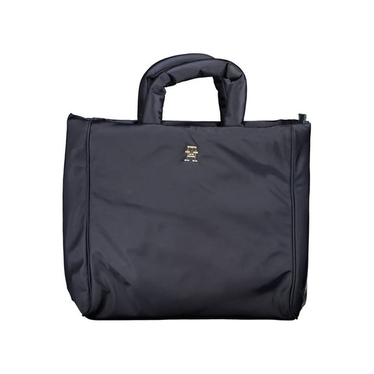 This Handbag by Tommy Hilfiger for women in polyester & polyethylene and blue presents a sculptural silhouette featuring a secure zipper, ample , and versatile shoulder-strap, adjustable-strap & handle for a sculptural finish.