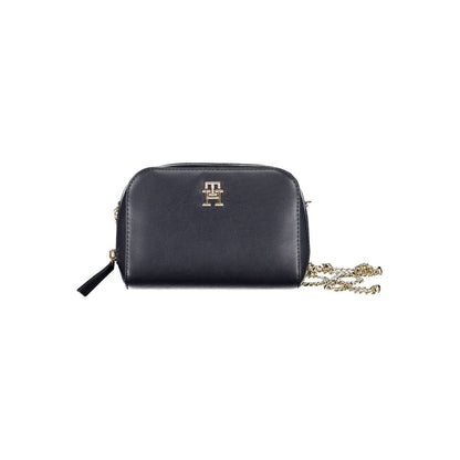 Shoulder Convertible Handbag by Tommy Hilfiger for women in polyethylene faux leather blue features a polished silhouette with a secure zipper, ample external-pockets & internal-pockets, and polished shoulder-strap for a sophisticated look.