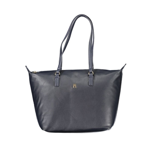 Handbag by Tommy Hilfiger for women in polyester blue & signature features a ornamental silhouette, showcasing a secure zipper, ample internal-pockets, and ornamental handle for a sophisticated look.
