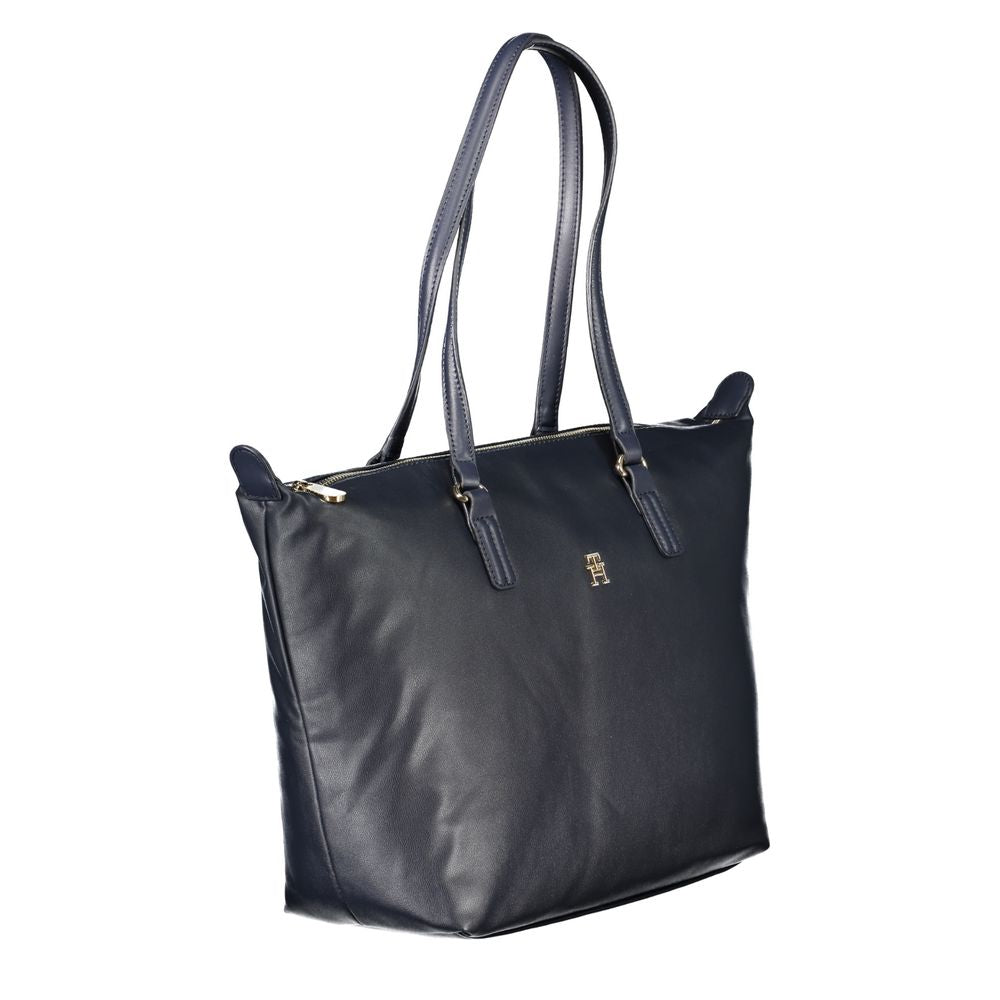 Handbag by Tommy Hilfiger for women in polyester blue & signature features a exquisite silhouette, showcasing a secure zipper and exquisite internal-pockets with versatile handle for a exquisite finish.