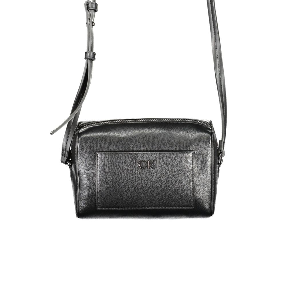Crossbody Convertible Handbag by Calvin Klein for women in faux patent & pebbled leather black features an exquisite silhouette, showcasing a secure zipper, ample external-pockets & cardholder, and versatile crossbody-strap & adjustable-strap for exquisite style.