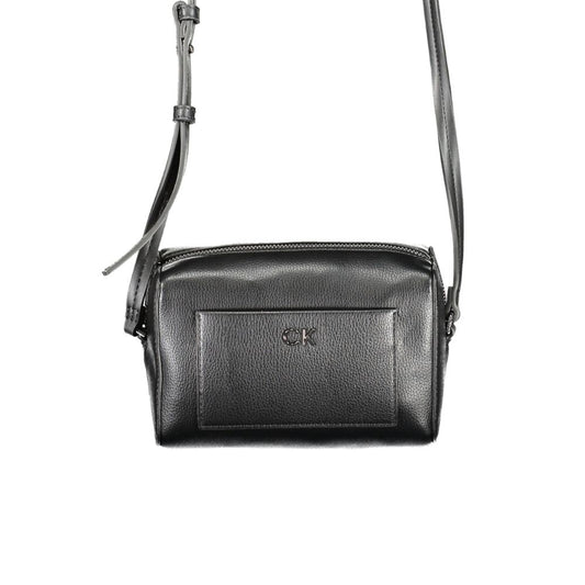 Crossbody Convertible Handbag by Calvin Klein for women in faux patent & pebbled leather black features an exquisite silhouette, showcasing a secure zipper, ample external-pockets & cardholder, and versatile crossbody-strap & adjustable-strap for exquisite style.