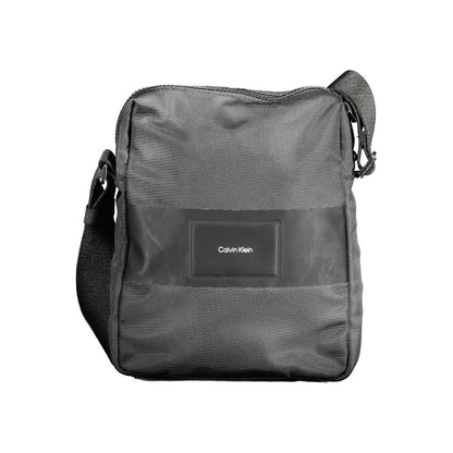 Evening Shoulder Bag by Calvin Klein for men in polyester & polyethylene black features a stately silhouette, showcasing a secure zipper, ample internal-pockets, and stately shoulder-strap & adjustable-strap for a stately finish.