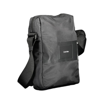 Evening Shoulder Bag by Calvin Klein for men in polyester & polyethylene black showcases a statuesque silhouette, artfully detailed with a secure zipper, organized internal-pockets, and versatile shoulder-strap & adjustable-strap for a statuesque look.