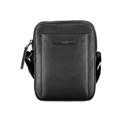 Shoulder Bag by Calvin Klein for men in polyester & polyethylene black showcases a statuesque silhouette, artfully detailed with a secure zipper, organized external-pockets & internal-pockets, and versatile shoulder-strap & adjustable-strap for a statuesque look.