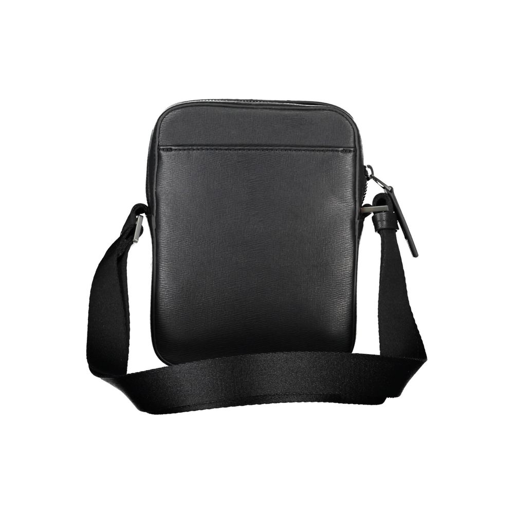 Shoulder Bag by Calvin Klein for men in polyester & polyethylene black features a stately silhouette, showcasing a secure zipper, ample external-pockets & internal-pockets, and stately shoulder-strap & adjustable-strap for a stately finish.