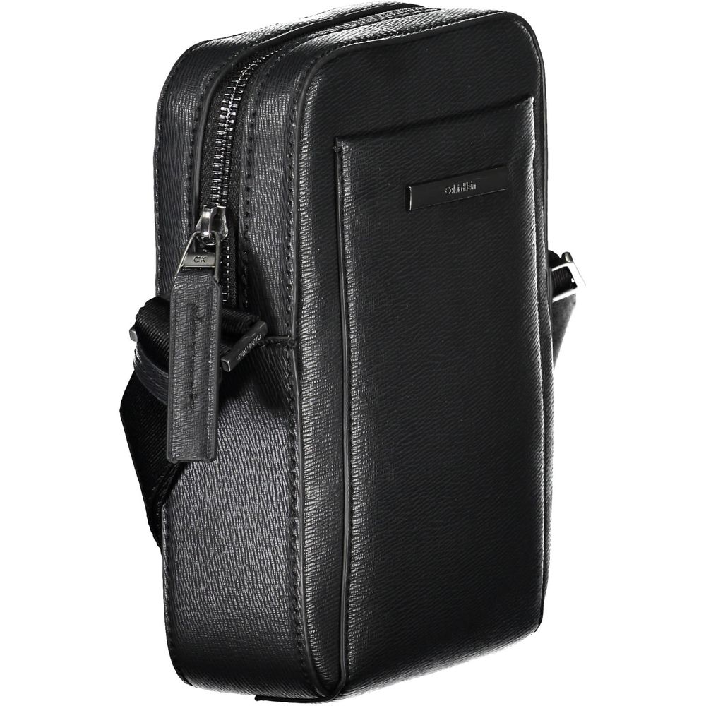 Shoulder Bag by Calvin Klein for men in polyester & polyethylene black features a statuesque silhouette, showcasing a secure zipper and statuesque external-pockets & internal-pockets with versatile shoulder-strap & adjustable-strap for a statuesque finish.