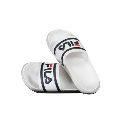 Slippers by Fila for women in polyethylene and white presents a sculptural silhouette as Women's Polyethylene Slippers, featuring a sculptural and a sculptural for refined comfort.