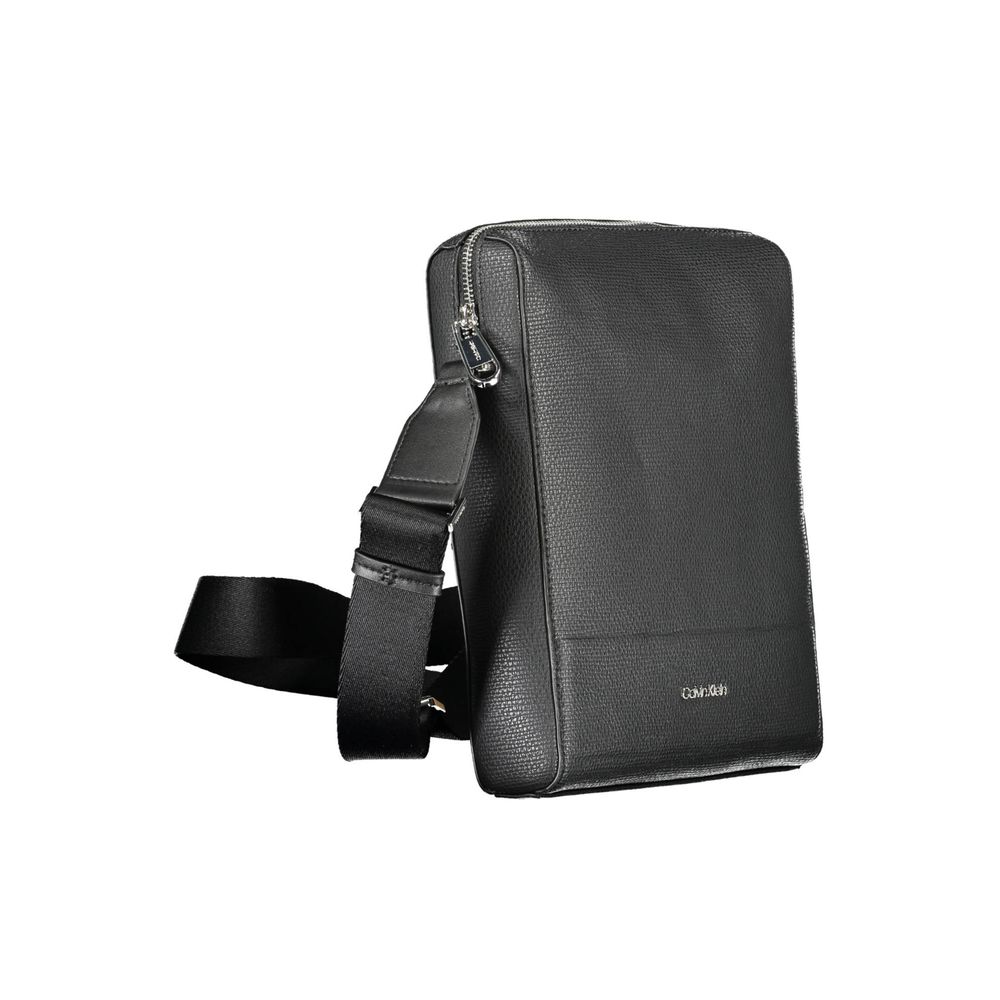Shoulder Bag by Calvin Klein for men in polyester & polyethylene black features a statuesque silhouette, showcasing a secure zipper and statuesque external-pockets & internal-pockets with versatile shoulder-strap & adjustable-strap for a statuesque finish.