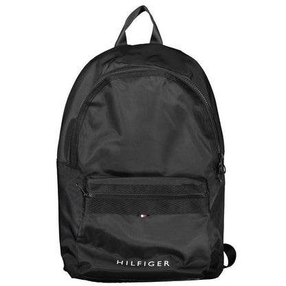 Backpack by Tommy Hilfiger for men in polyester black & signature presents a stately Polyester Backpack design, showcasing a secure zipper with ample external-pockets & laptop-compartment and versatile backpack-strap, adjustable-strap & handle for a stately finish.