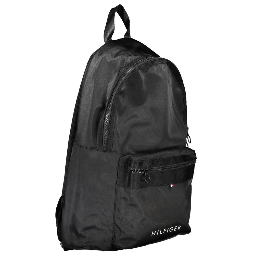 Backpack by Tommy Hilfiger for men in polyester black & signature features an stately silhouette from the Polyester Backpack range, with a secure zipper, ample external-pockets & laptop-compartment, and versatile backpack-strap, adjustable-strap & handle.