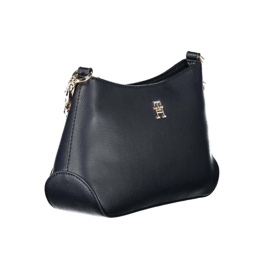 Shoulder Handbag by Tommy Hilfiger for women in polyester blue & signature features a ornamental silhouette, showcasing a secure zipper, ample internal-pockets, and ornamental shoulder-strap & adjustable-strap for a sophisticated look.