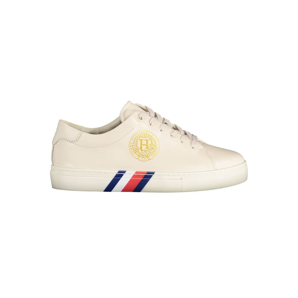 Sneakers by Tommy Hilfiger for women in organic cotton & poly leather beige presents a sumptuous silhouette from the Women's Casual Organic Cotton & Poly Leather Sneakers collection, showcasing a sumptuous casual style for an elevated aesthetic.