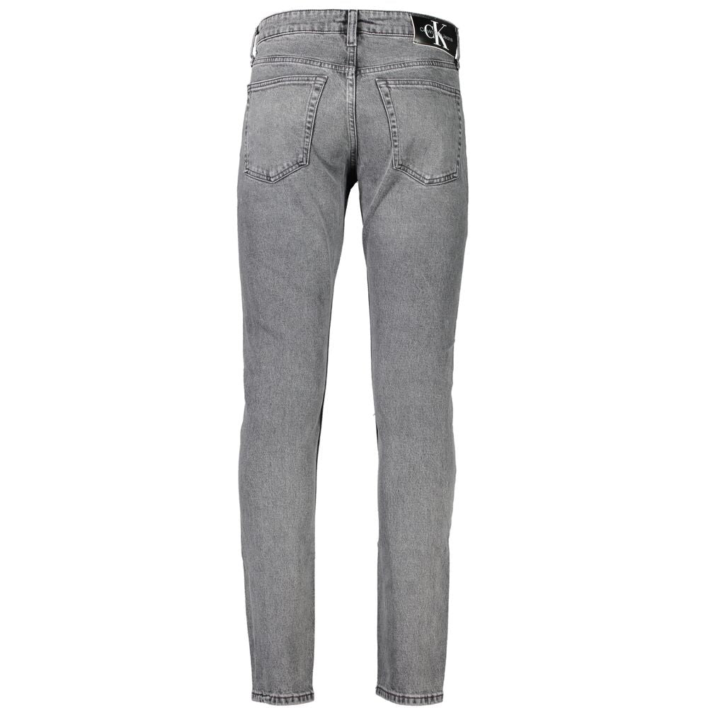Jeans by Calvin Klein for men in stretch denim cotton gray features a polished silhouette with a polished slim, reaching a polished long and finished with a polished .