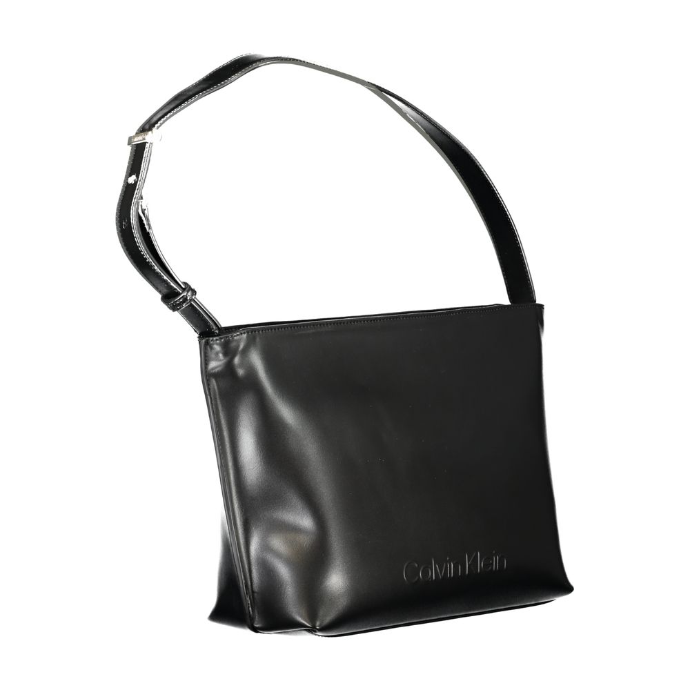 Shoulder Convertible Handbag by Calvin Klein for women in polyester polyethylene faux leather black presents a enviable design with a secure zipper, ample internal-pockets, and versatile shoulder-strap & handle for a sophisticated look.