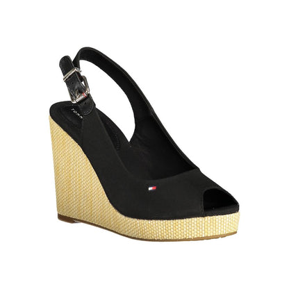 Wedge Sandals by Tommy Hilfiger for women in polyester polyethylene cotton and black presents a sculptural silhouette, showcasing the signature style of the Women's Polyester Polyethylene Cotton Wedge Sandals with a sculptural wedge and sculptural .