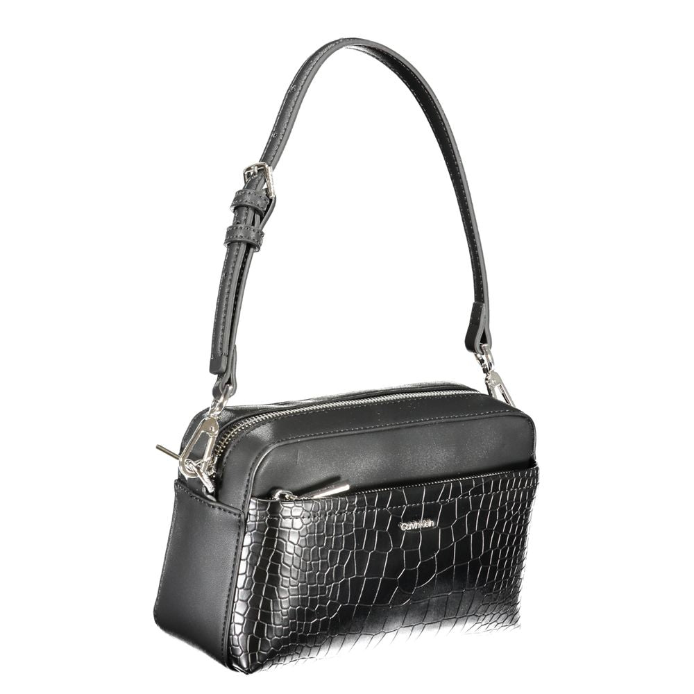 2-in-1 Shoulder & Crossbody Convertible Handbag by Calvin Klein for women in faux crocodile skin leather black features an exquisite silhouette, showcasing a secure zipper, ample external-pockets & internal-pockets, and versatile crossbody-strap, shoulder-strap, adjustable-strap & handle for exquisite style.