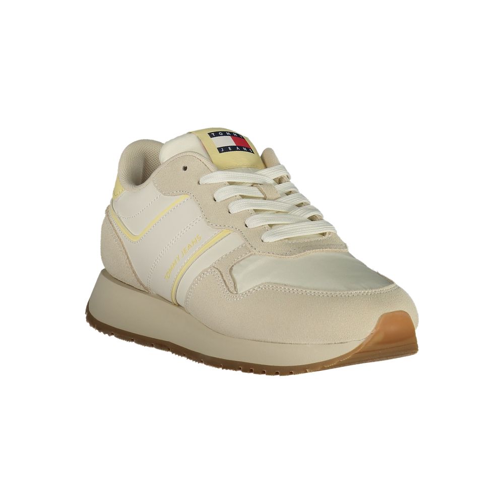Athletic Sneakers by Tommy Hilfiger for women in polyester polyethylene leather beige showcases a architectural silhouette, artfully capturing the essence of the Women's Athletic Polyester Polyethylene Leather Sneakers with its signature architectural athletic style construction.