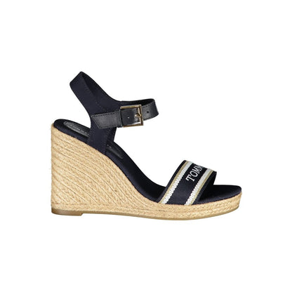 Wedge Sandals by Tommy Hilfiger for women in polyester polyurethane leather blue features an architectural design from the Women's Polyester Polyurethane Leather Wedge Sandals collection, defined by a architectural wedge and for a architectural finish.